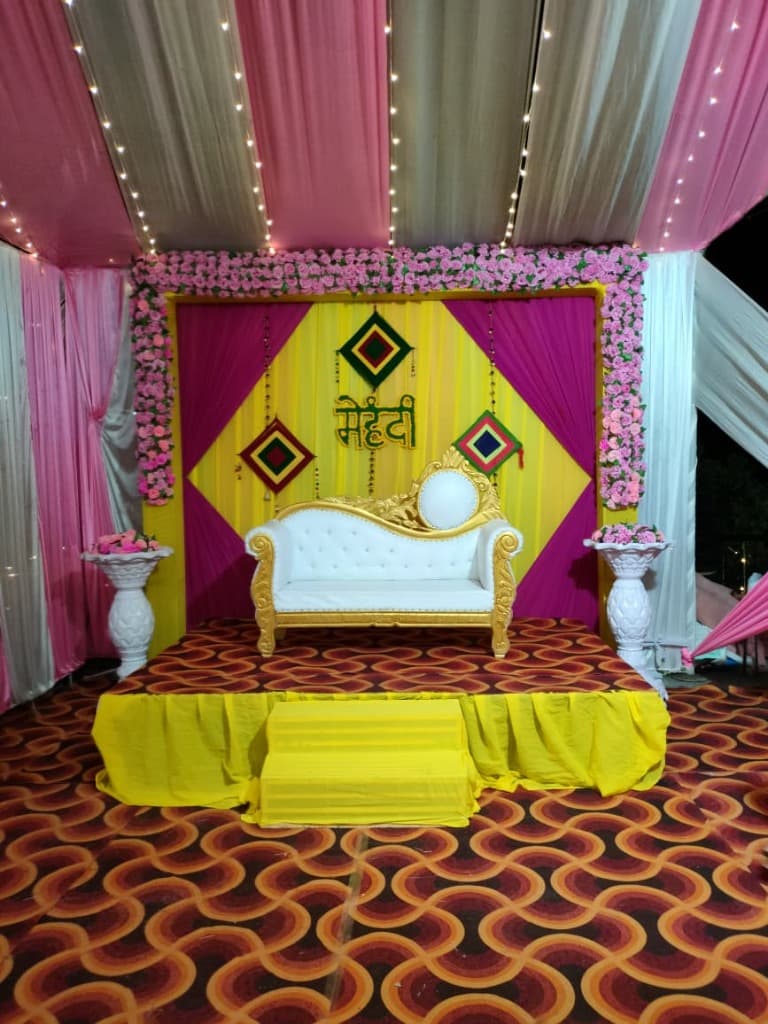 Vibrant Mehndi Stage & Gold Sofa